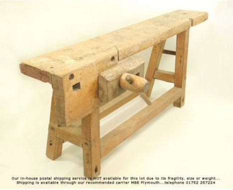 WORK BENCH. A 19th century pine &amp; oak carpenter's work bench with wooden vice. Length 175. Height 65cm.