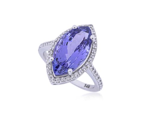 A MARQUISE CUT TANZANITE AND DIAMOND RING Featuring a marquise cut tanzanite weighing approximately 7.45 Cts, mounted in a wh