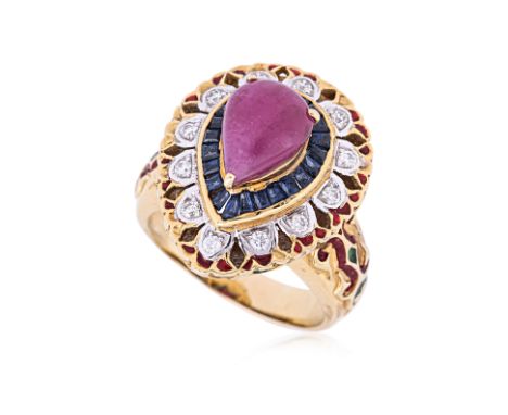 A RUBY AND DIAMOND RING
Featuring a pear shaped cabochon ruby accented with tapered baguette sapphires and round brilliant di