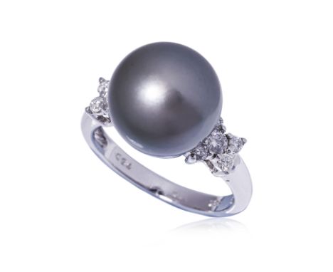 A TAHITIAN CULUTURED PEARL AND DIAMOND RING Featuring a Tahitian cultured pearl measuring approximately 12.3 mm, mounted in a