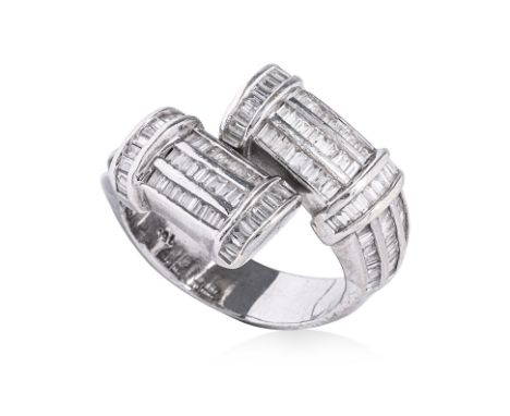 A BAGUETTE DIAMOND CROSSOVER RING
The crossover ring featuring rows of baguette cut diamonds totalling approximately 1.28 Cts