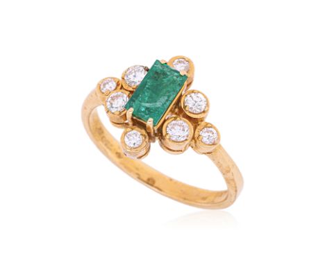 AN EMERALD AND DIAMOND RING
Featuring an emerald weighing approximately 0.53 Cts, (a rather large surface reaching inclusion 