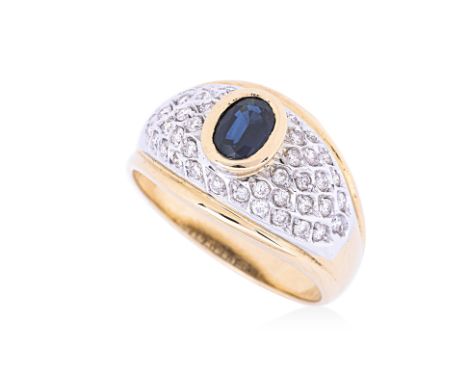 A SAPPHIRE AND DIAMOND RING
Featuring an oval cut sapphire weighing approximately 1.0 Cts, mounted in a two tone gold setting