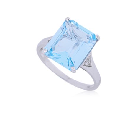 A BLUE TOPAZ AND DIAMOND RING
Featuring an emerald cut blue topaz weighing approximately 5.0 Cts, mounted in a white gold set