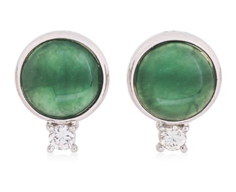 A PAIR OF JADE AND DIAMOND EAR STUDS
Featuring two round jade pieces, possibly nephrite, mounted in a platinum setting marked