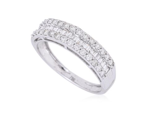 A THREE ROW DIAMOND RING
Featuring round brilliant & baguette cut diamonds totalling approximately 0.80 Cts, mounted in a whi