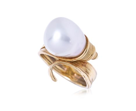 A BAROQUE CULTURED PEARL RING BY TASAKI Featuring a cultured baroque pearl mounted in a yellow gold setting marked 'K18' and 