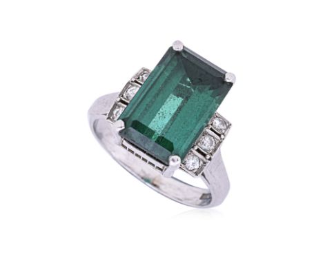 A TOURMALINE AND DIAMOND PLATINUM RING
Featuring an emerald cut green tourmaline weighing approximately 8.45 Cts, mounted in 