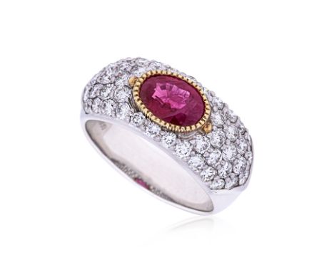 A RUBY AND DIAMOND RING Featuring an oval cut ruby weighing approximately 1.25 Cts (marked), mounted in a platinum &amp; yell