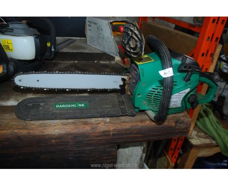 A green Gardenline chainsaw - (good compression, little used).