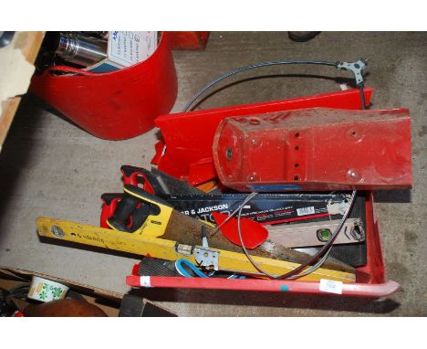 A box of tools, levels and saws