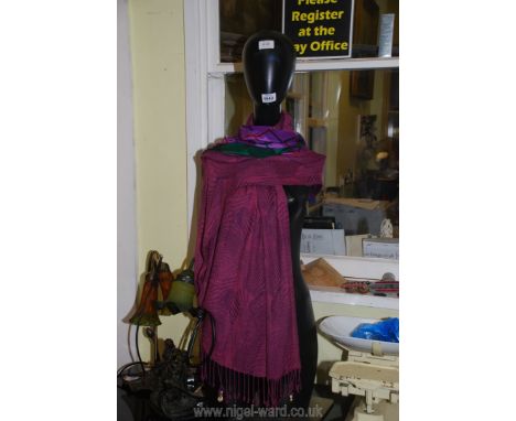 A mannequin with scarf.