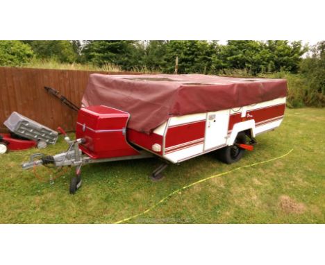 A 1996 Pennine Pullman folding trailer tent. Can be used without pegging out. Has full awning that doubles size of area (awni