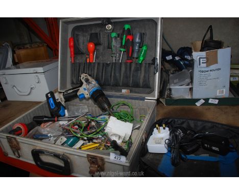 A plastic tool box with various tools, an 18 volt cordless drill with charger.  