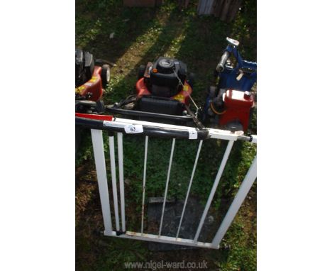 A Mountfield 150cc petrol mower - no grass box, plus a safety gate.