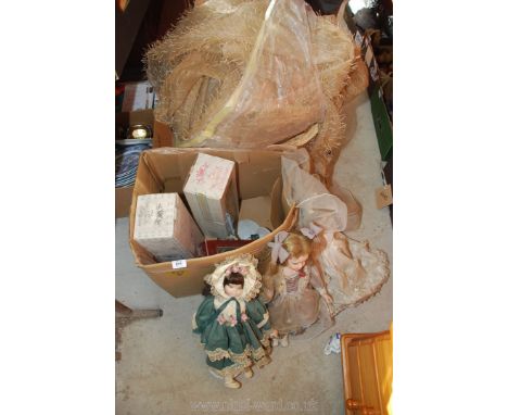 A box of dolls, a basket, curtains etc.