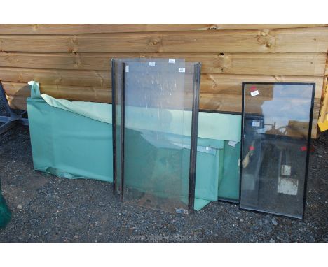 A quantity of glass panels including two Sanderson tractor window panels. 
