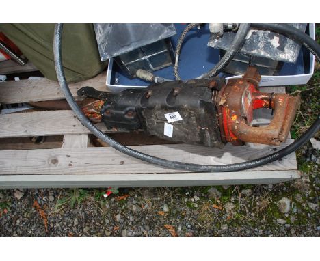 A pneumatic jack hammer with airline hose.