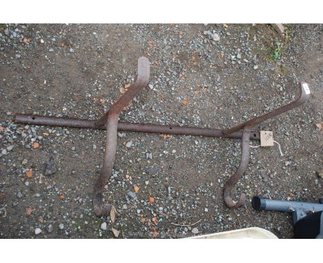 A wrought iron trough bracket.