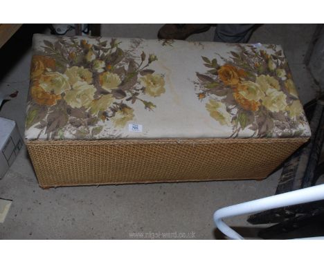A linen Ottoman and cushion.