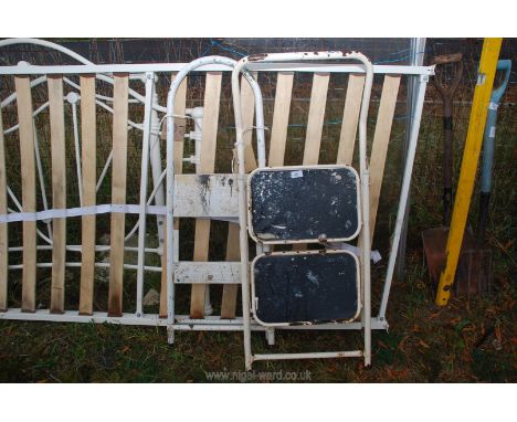 Two metal two rung step ladders. 