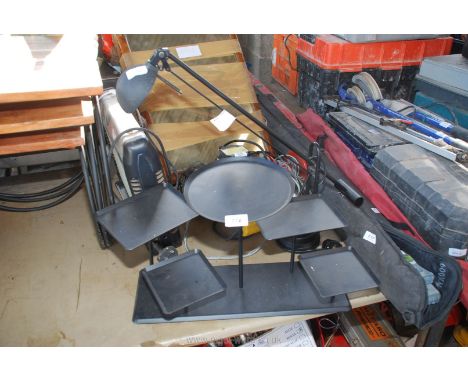 A metal stand and desk lamp.