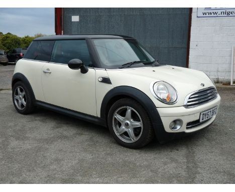 A BMW Mini Cooper 1,598 cc Petrol three-door hatchback with 6-speed manual gearbox, attractively finished in white with a bla