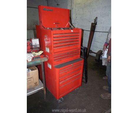 A large two tier "Snap-on" roll-along tool storage cabinet and comprehensive contents including: Chicago Pneumatics & Snap-on