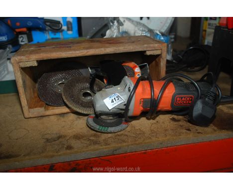 A Black &amp; Decker 4 1/2" angle grinder with safety guard and discs, working at time of testing.