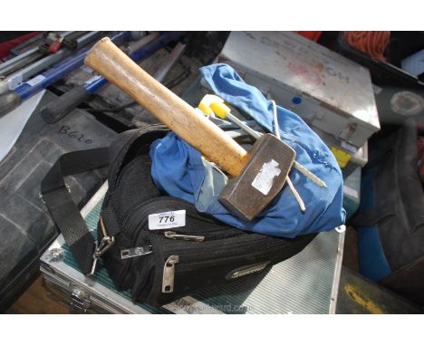 Tent pegs and hammer with case.