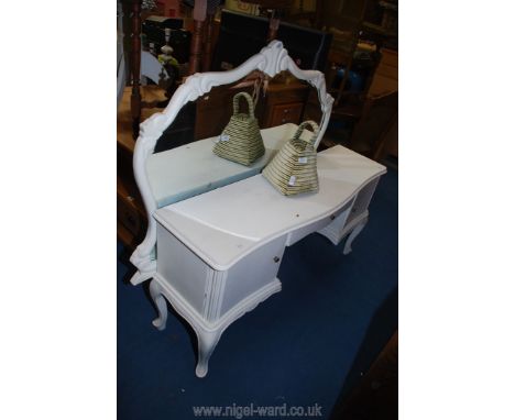 A white painted dressing table with a shaped mirror back, 54" wide x 15" deep x 28" and 64" high overall. 