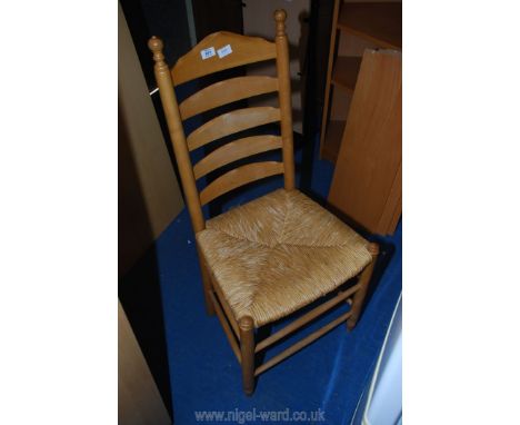 A light Ash framed ladderback sea-grass seated side chair.