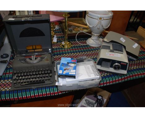 An Imperial Good Companion typewriter, Aldis projector and Canon Selphy printer.