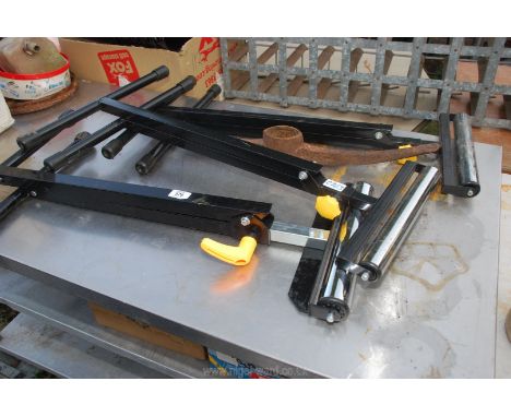 Three adjustable roller benches plus a pick axe head.