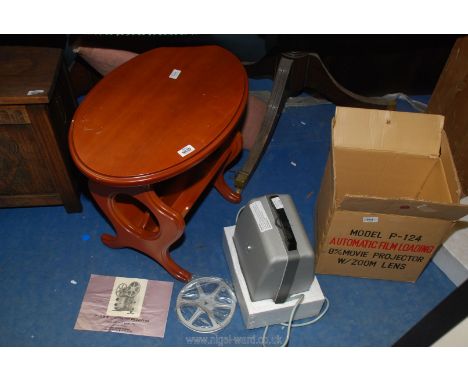 A film projector and a magazine rack side table.