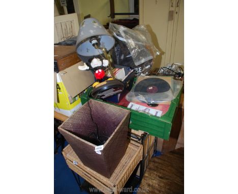 A quantity of 45 rpm/His Master's Voice records and a Mickey Mouse table lamp and waste paper bin.