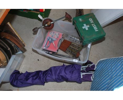 A box of tools, breast drill wood boring bits, staple gun, camping chair and First Aid Kit.