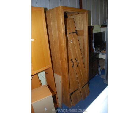 A double doored light Oak single wardrobe, 29" wide x 27 1/2" deep x 79" high.