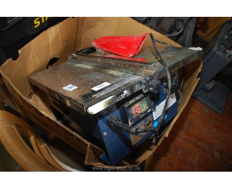 An electric tile cutter, working at time of testing.