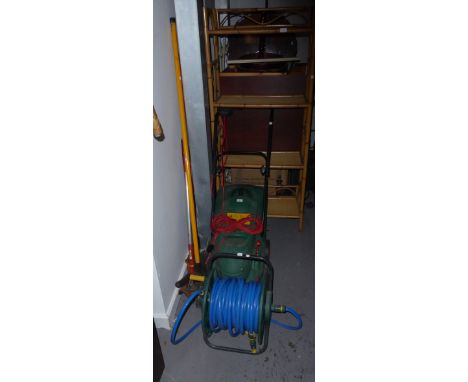 A QUALCAST ELECTRIC ROTARY LAWN MOWER, A GARDEN HOSE ON REEL AND GARDEN TOOLS 
