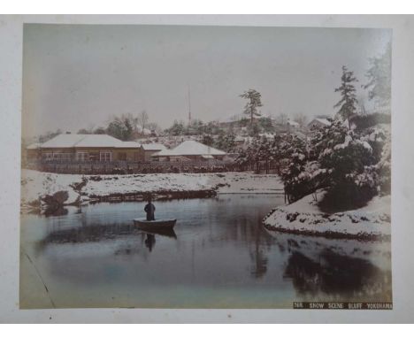 PHOTOGRAPHS. A lacquered album containing 32 hand-coloured albumen-print photographs of Japan, mostly Yokohama, leaves 26cm x