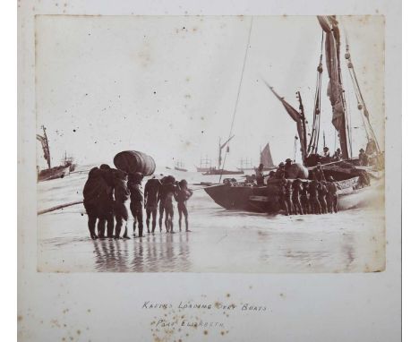 PHOTOGRAPHS. An album containing 32 mounted albumen-print photographs of people and topographical views in South Africa, Made