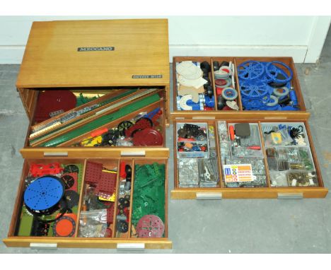 Meccano No.10 outfit, late issue 4-draw light oak cabinet with a quantity of mixed period parts including pulleys, boilers, n