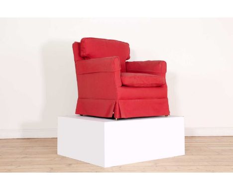 An upholstered armchair by Howard &amp; Sons,c.1900, of square shape, upholstered in red fabric, raised on tapering square su
