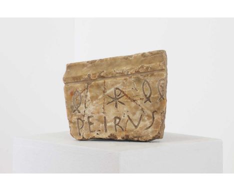 An early Christian alabaster panel fragment, First Millennium AD, inscribed 'PEIRUS' with ichthys and chi-rho symbols, 14 x 1