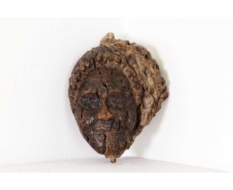 A burrwood root carving, 19th century, with the relief of a woman's face, from Kate's Cellar, Epping Forest, 14 x 10.5cm,toge
