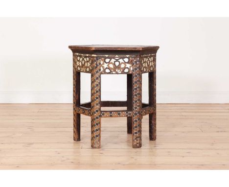 An octagonal inlaid occasional table,20th century, Syrian, decorated with mother-of-pearl,57cm wide58cm highCondition ReportG