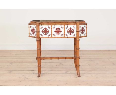 A late Victorian faux bamboo jardinière,c.1880, the octagonal basin fitted with a liner and set with pottery tiles with cruci