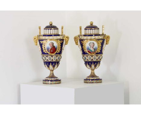 A pair of Sèvres-style vases and covers,c.1870, each with a central gilt-edged panel depicting Louis XVI and Marie Antoinette