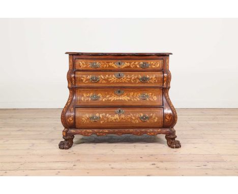An oak and marquetry commode,early 19th century, Dutch, of bombé outline, the shaped top above four graduated long drawers, r